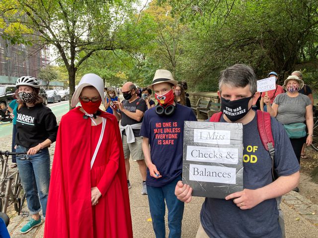Erika Drezner dressed as a handmaid during a protest on September 26th, 2020.